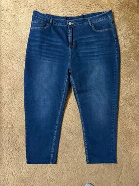 Women's High-Rise Slim Capris in Deep Blue Denim have been taken in at waist